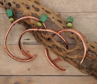 set of 3 copper cuff blue green gemstone bracelets on cactus skeleton