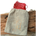 tan-linen-jdavis-collection-jewerly-bag-stuffed-with-red-burlap-on-brown-wood-background