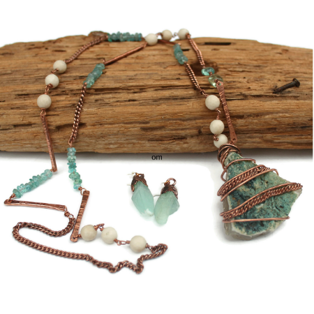 Long Copper bars, blue and white beaded necklace on brown wood with blue calcite electroformed earrings