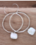 sterling hoop pearl earrings on wood