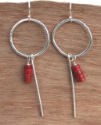 sterling coral earrings on wood