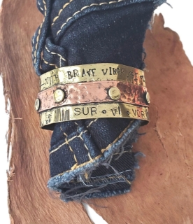 riveted mixed metal cuff on denim