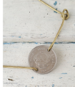 Petite silver coin  gold bar bracelet on white distressed wood