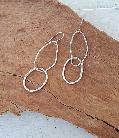 Organic artisan statement earrings on wood
