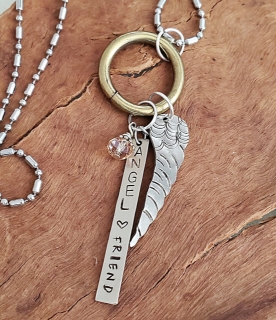 Angel wing chain silver necklace on wood