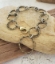 stamped brass circles bracelet on rocks