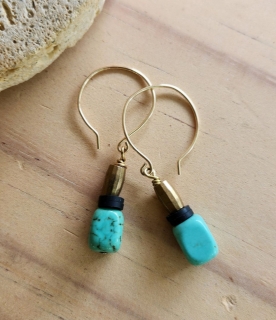 gold mini hoop turquoise, black earrings on wood table