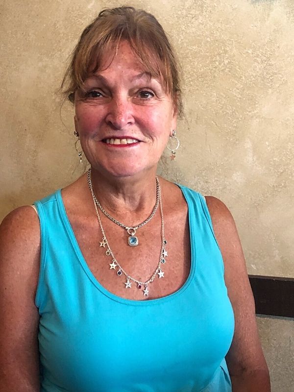 wearing silver star & crystal necklace in aqua dress