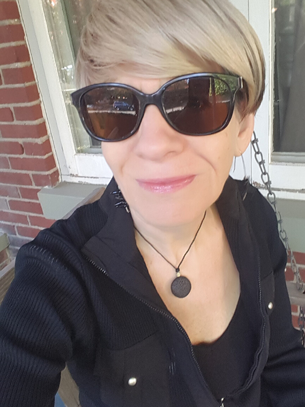 black outfit and necklace on female