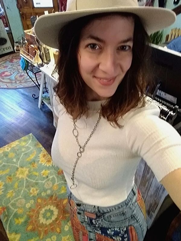 silver chunky chain necklace worn with denim skirt