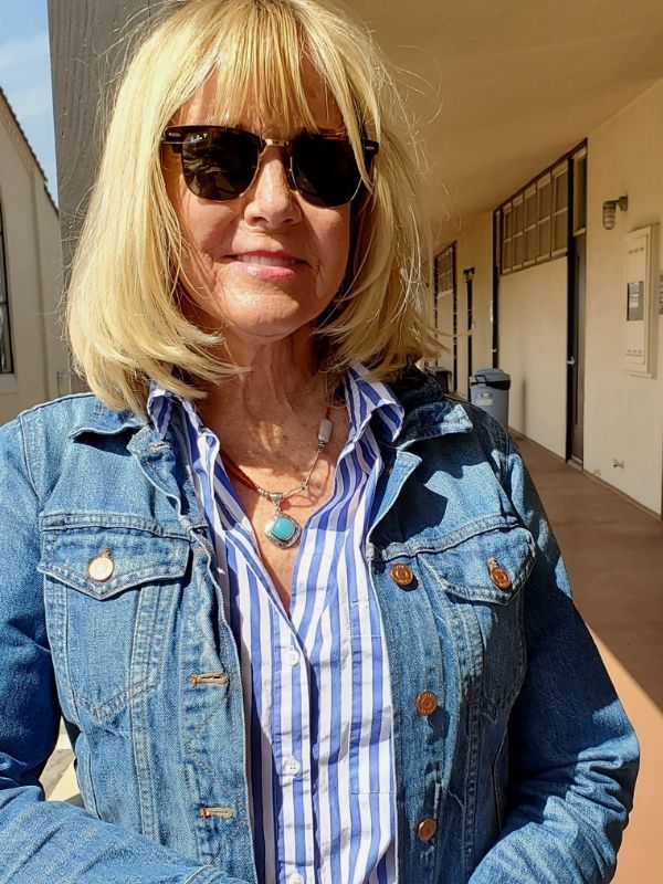 arty gemstone necklace worn with stripes and denim