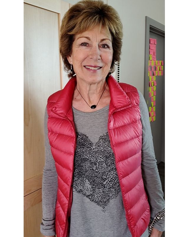 black and silver necklace & earrings being worn