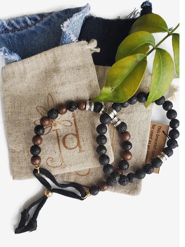 2 men's beaded bracelets with jewelry bags