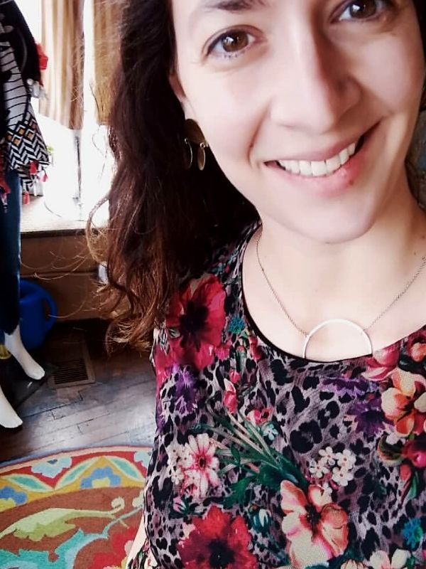 silver circle necklace on flower print johnny was top