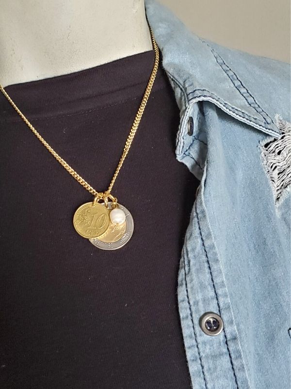 european coin necklace on black top