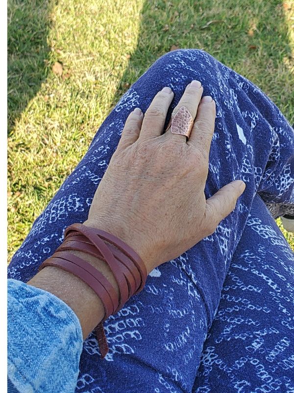 wearing a leather wrap bracelet