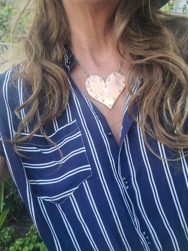 striped top worn with rivited jewelry