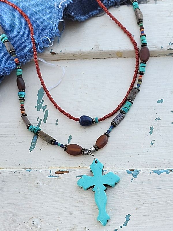 earthy gemstone cross necklace with denim