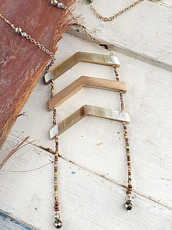 beaded, chain chevron necklace on trunk