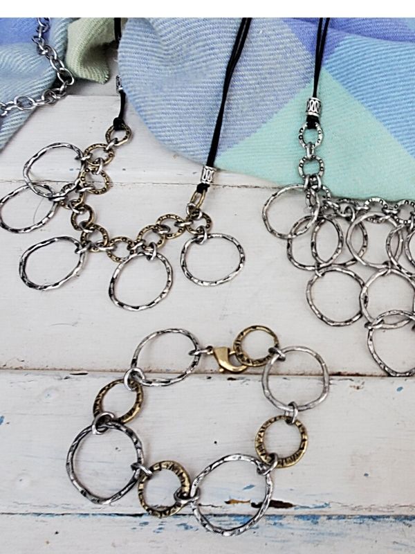 silver chain bib necklaces displayed