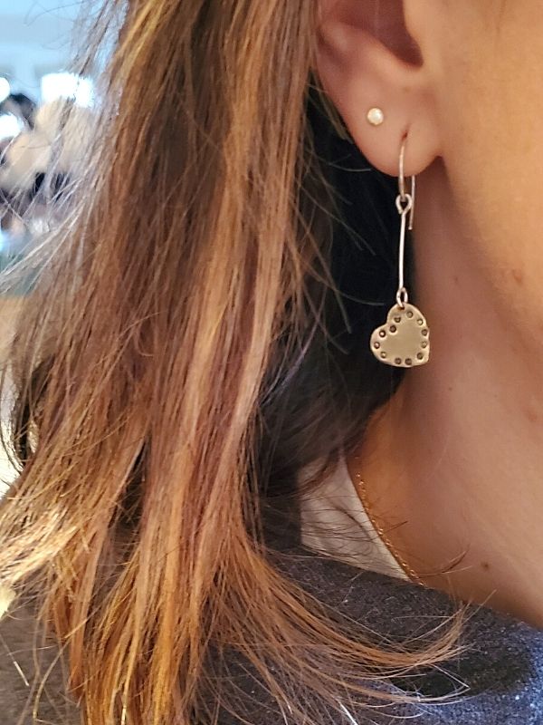 heart stick earrings on female