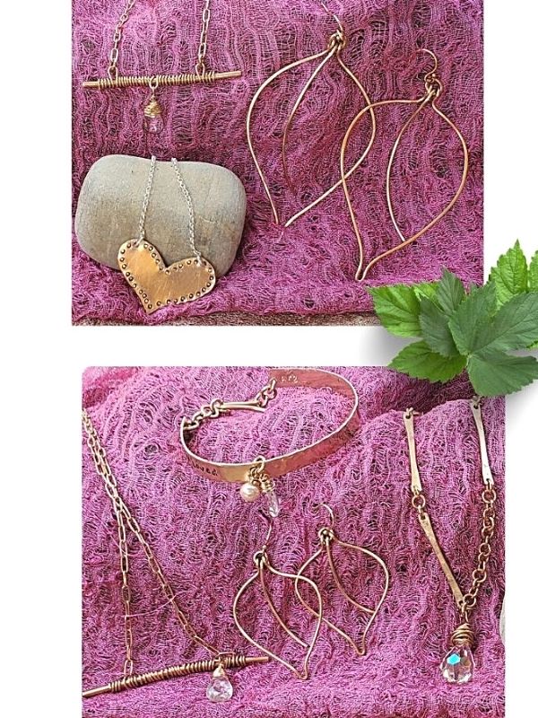 collection of feminine jewelry on pink scarf