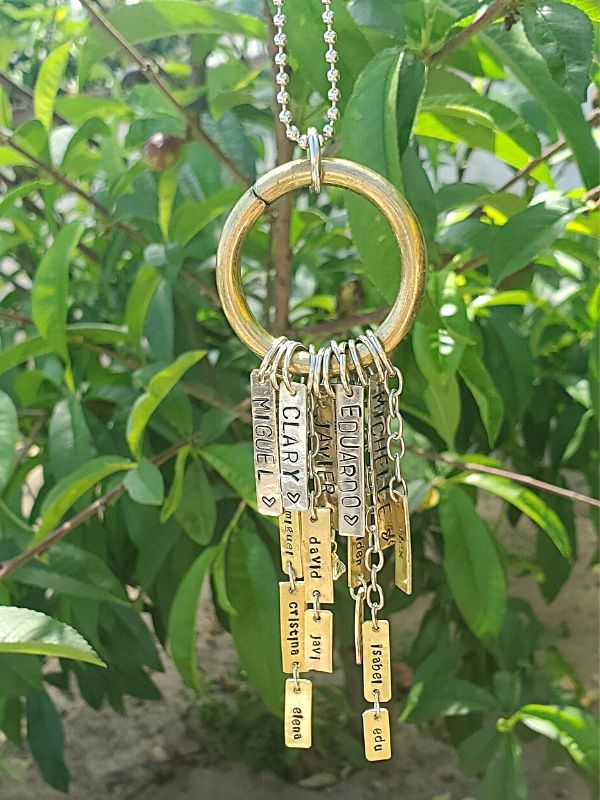 tiered family tree necklace hanging from tree