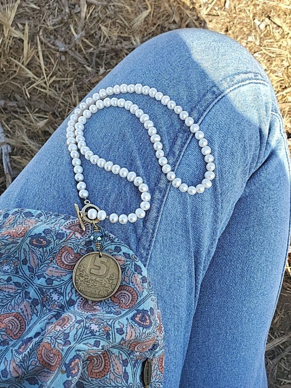 pearl necklace with blue jeans
