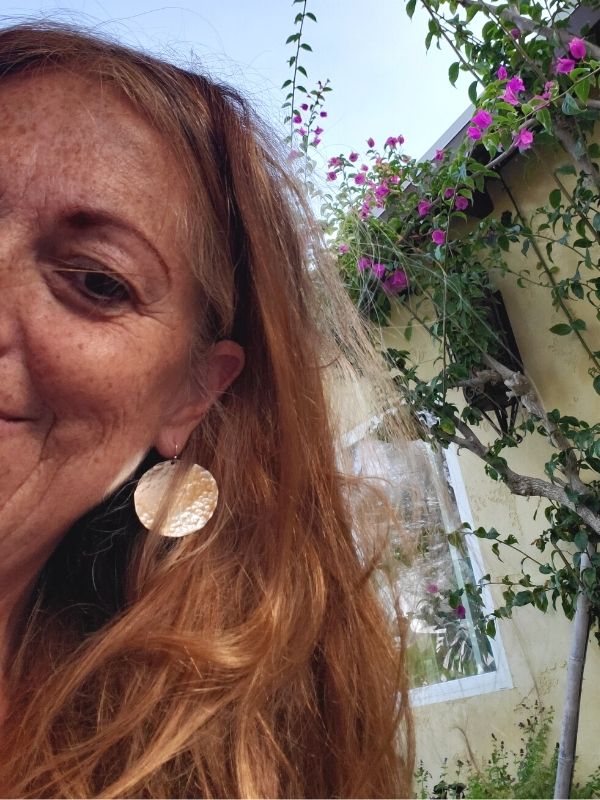 big disc earrings being worn