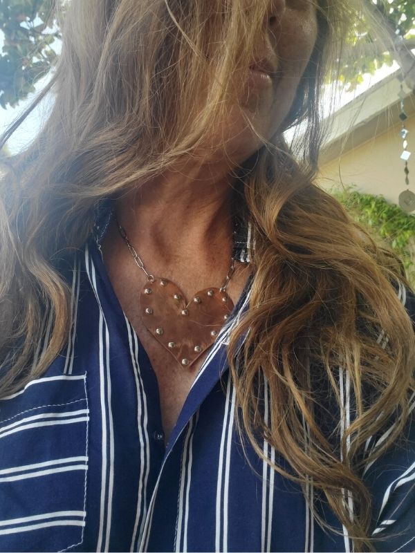 wearing a giant riveted copper heart statement necklace