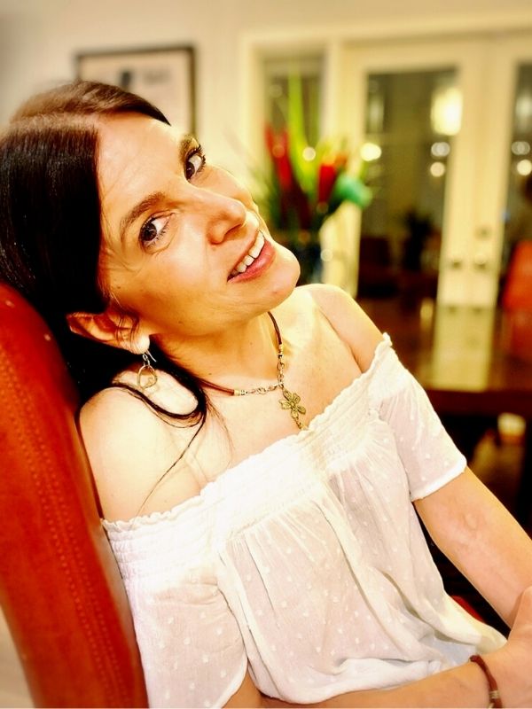 metal flower necklace on female