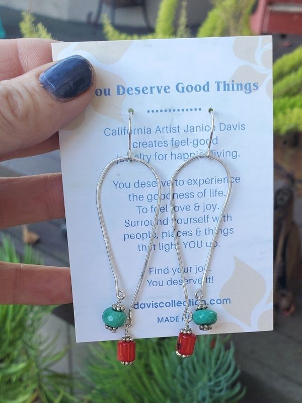 silver elongated oval earrings on card