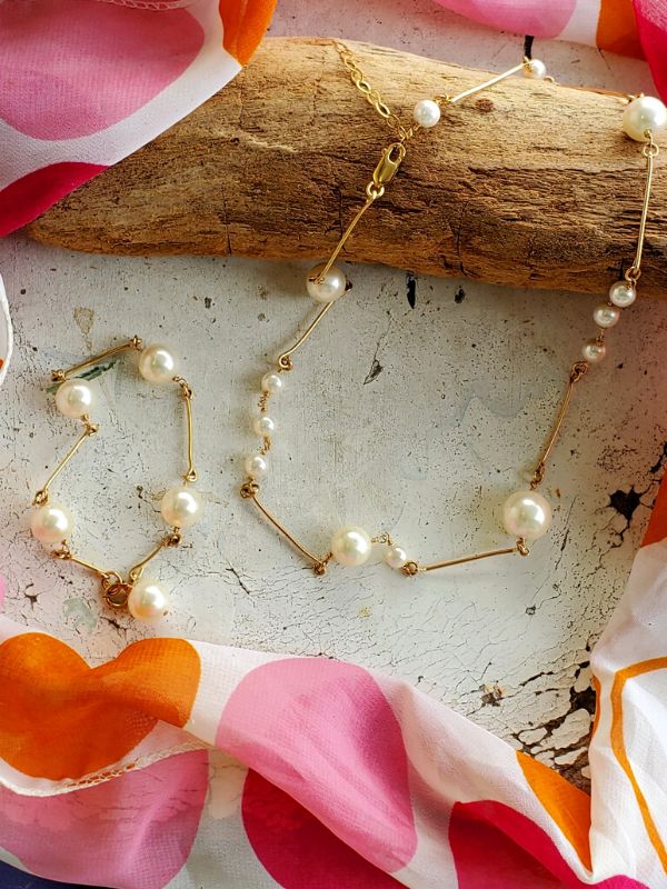 white pearl jewelry with colorful scarf