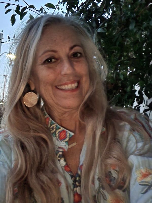 wearing big gold hammered disc earrings