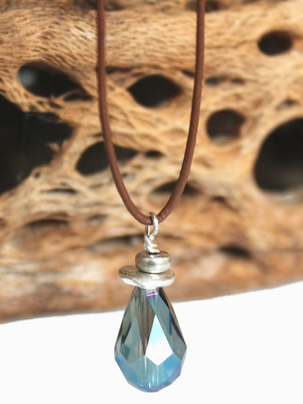 crystal pendant brown leather necklace on cholla skeleton