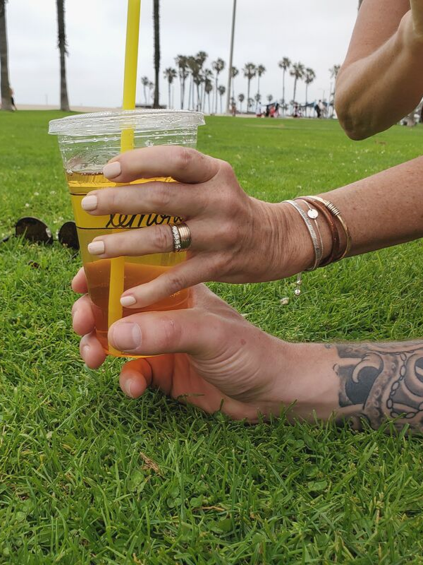 arm with tattoo & arm with bracelet stacked